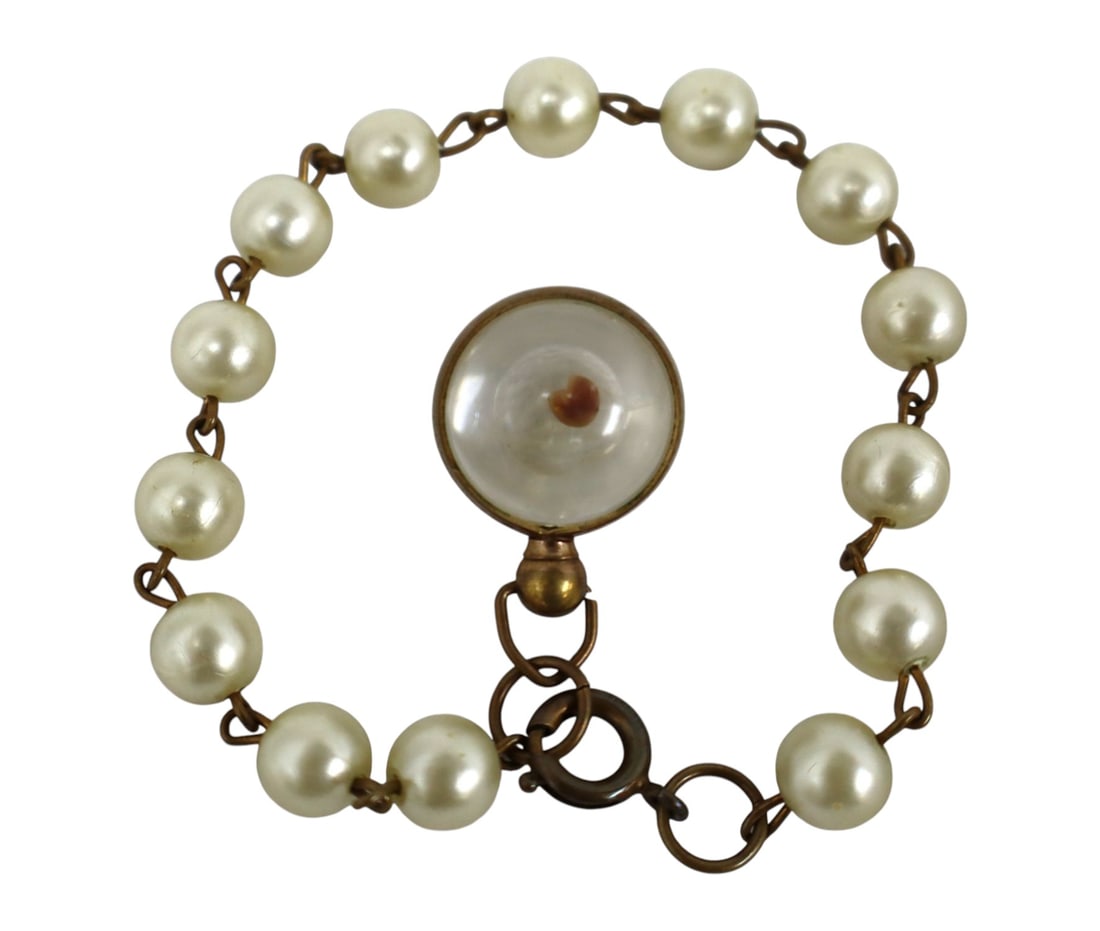 Faux pearl bracelet object in glass orb: Vintage style faux pearl bracelet object in glass orb 8"