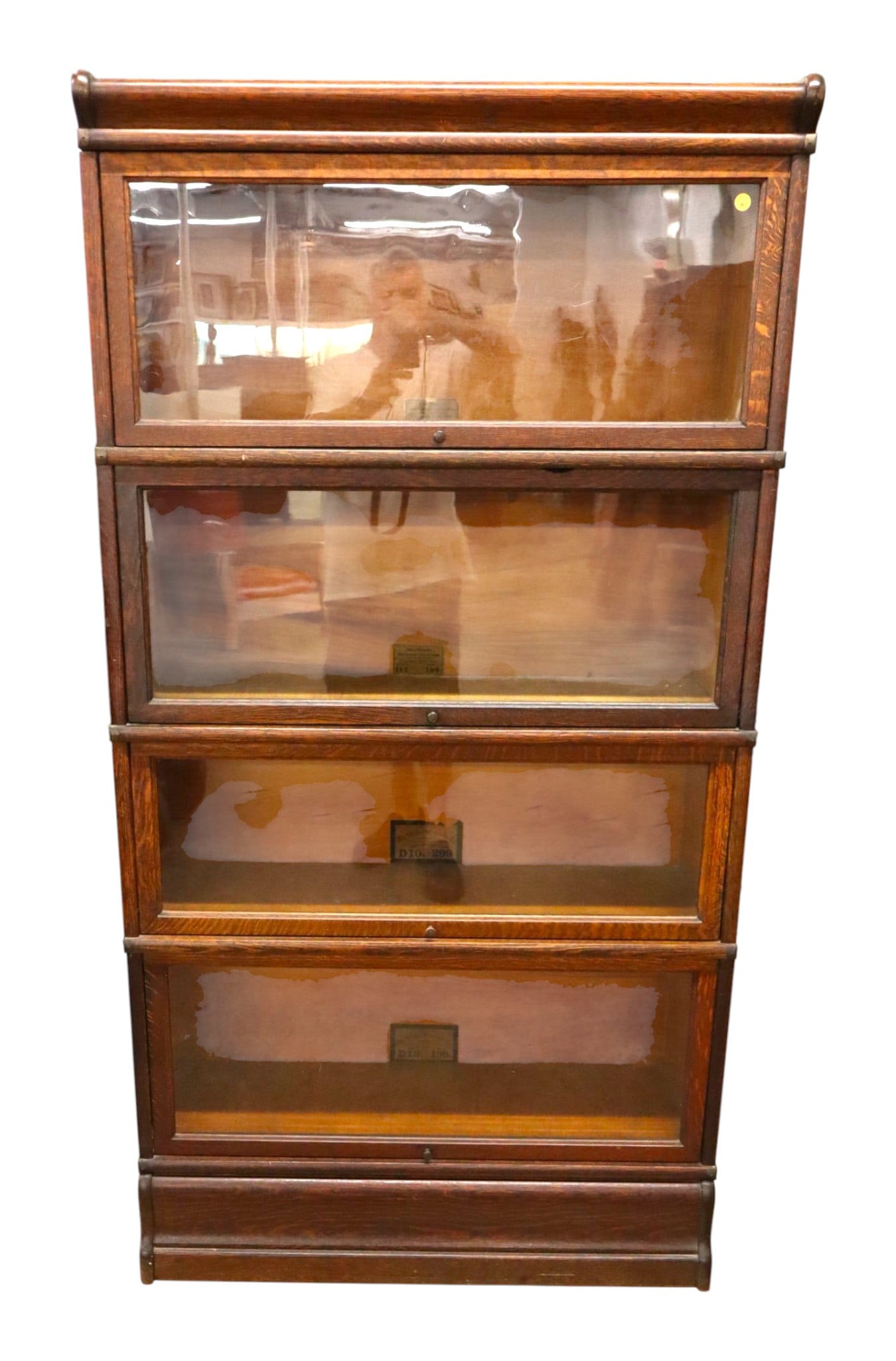 Globe Wernicke 4-Stack Oak Barrister Bookcase: Antique globe Wernicke 4 stack quartersawn oak barrister bookcase with original labels, original wavy glass & original finish, structurally sound and in good condition. 65.5"h x 34"w x 11.5"d