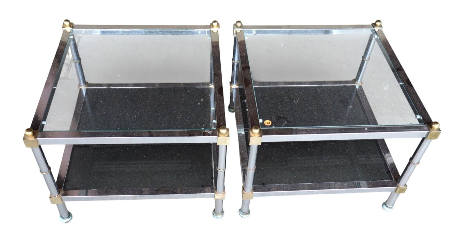 Pair MCM Chrome Brass Smoked Glass 2-Tier Tables: Pair mid century modern square chrome and brass smoke glass top 2 tier lamp tables, glass is good, structurally sound and in good condition for age. Ea. 17"h x 20.5"w x 20.5"d
