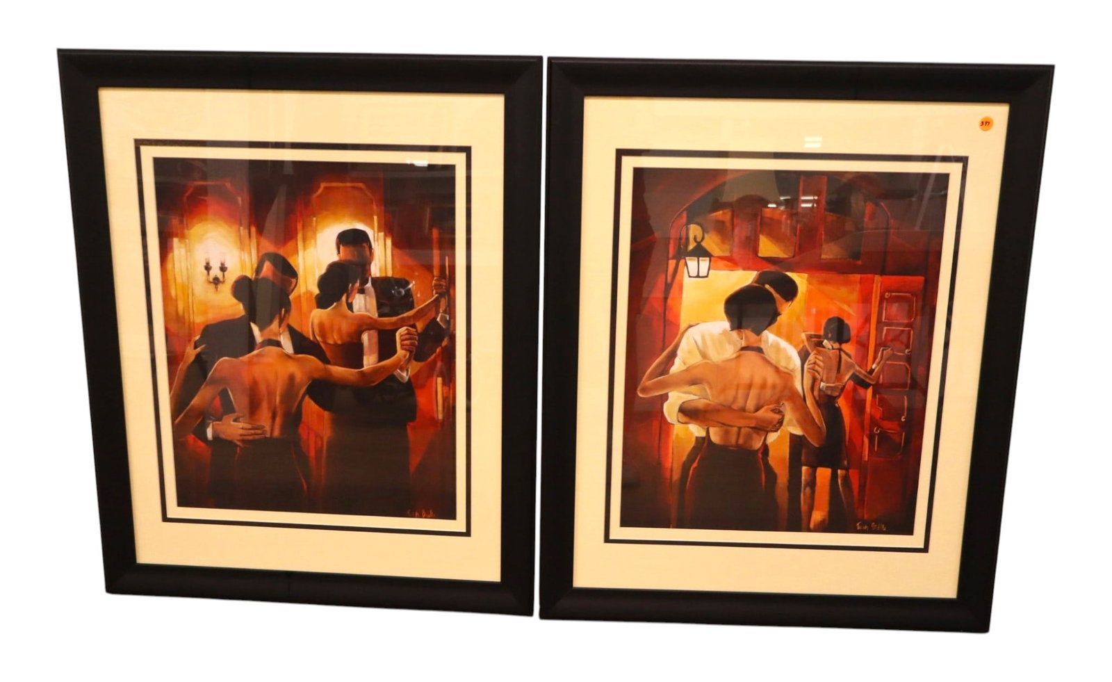 Pair Trish Biddle Signed Dancer Framed Prints: A beautiful pair of Trish Biddle fine art prints capturing intimate ballroom dancing scenes in a rich Art Deco style printed with the artist's signature. Elegantly triple-matted behind glass inside ma