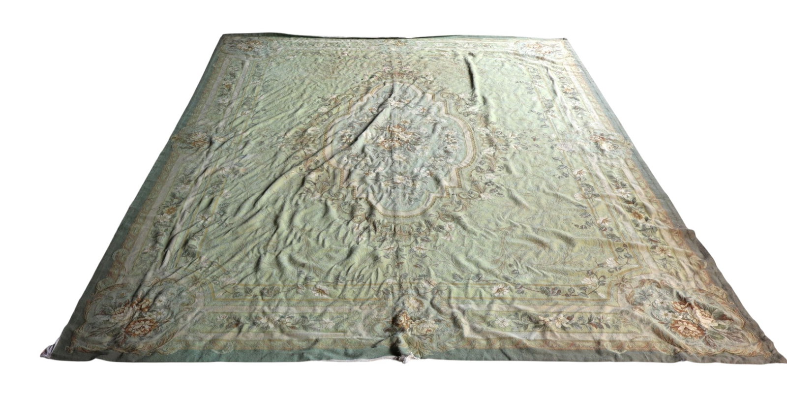 Hand Made French Style Wool Needlepoint Rug 11.6x14: Large hand-made wool needlepoint tapestry rug in a French floral style with a sage green ground. Measures 11.6 ft x 14 ft. Displays perimeter edge fraying, canvas unraveling, and a border tear. 14 ft 