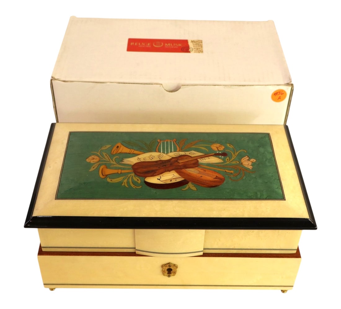 Vintage 1974 Reuge Italian Inlay Music Box Handel: Vintage 1974 Reuge Swiss music box in an Italian Sorrento wood inlay case. Plays Handel's "Water Music." Features pivoting drawers. Like new condition with original box and papers. 5"H x 10.75"W x 6"D