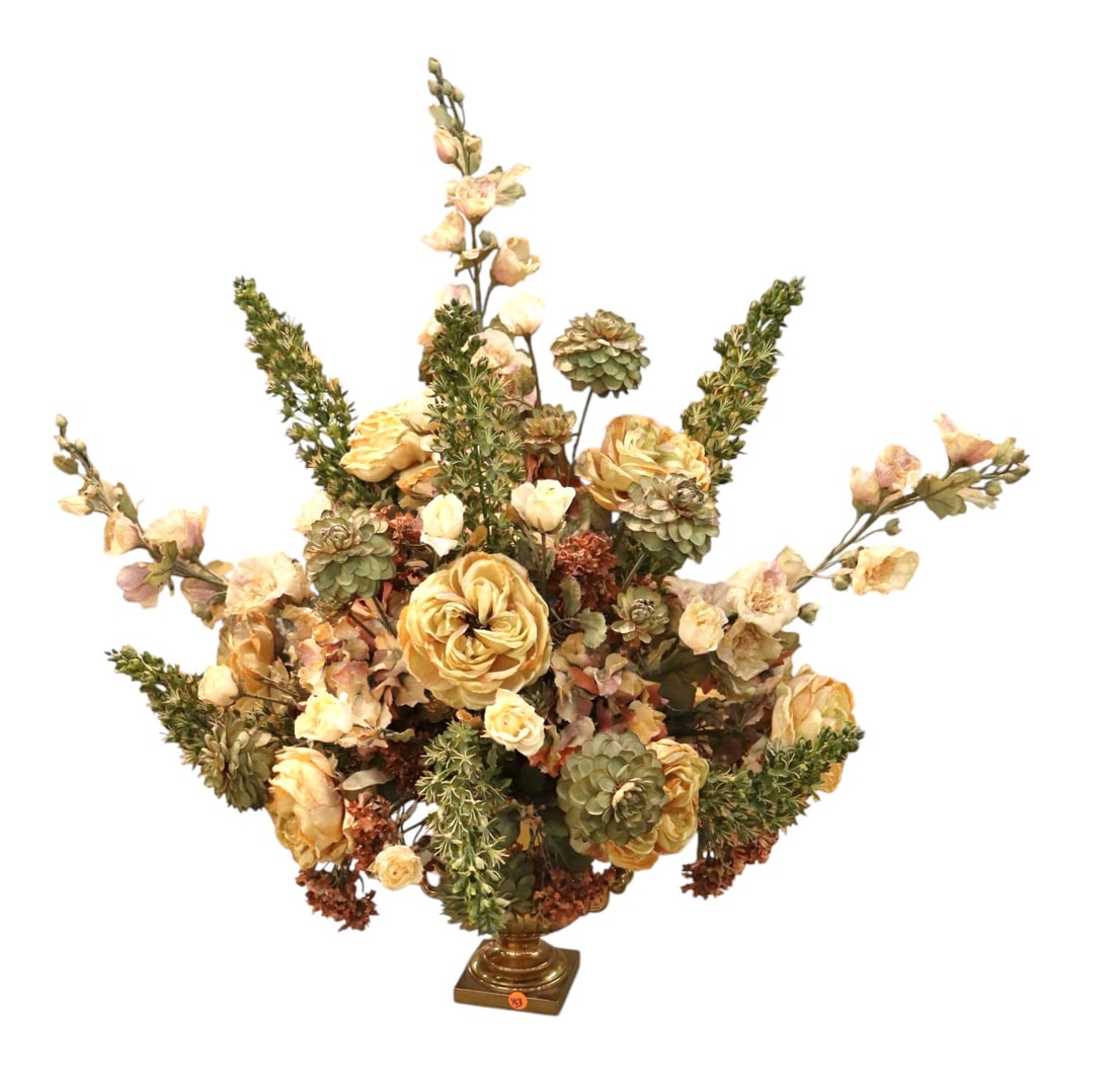 Quality faux floral arrangement in brass double handle vase: Quality faux floral arrangement in brass double handle vase, needs dusted, structurally sound. Footprint: flowers are 36"h x 34"w