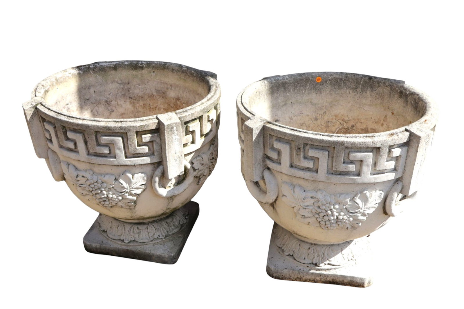 Pair Vintage Cast Concrete Roman Key Grape Urns 24: Fantastic pair of large vintage Neo-Classical cast concrete urn planters with a Roman key band and raised grape motif. Weathered patina. Structurally sound; one base corner repair. Each 24"H x 26" dia