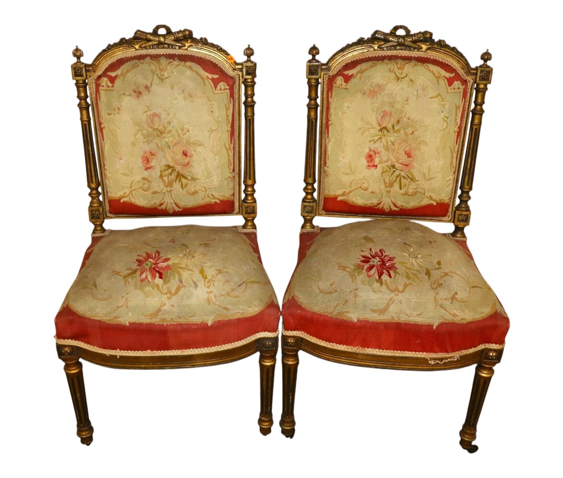 PR antique FR side chairs w/ orig. needlepoint upholstery: Pair of antique French side chairs with original needlepoint upholstery in carved gold gilt, structurally sound with wear on upholstery. Ea. 36.5"h x 20"w x 19"d seat height 19"