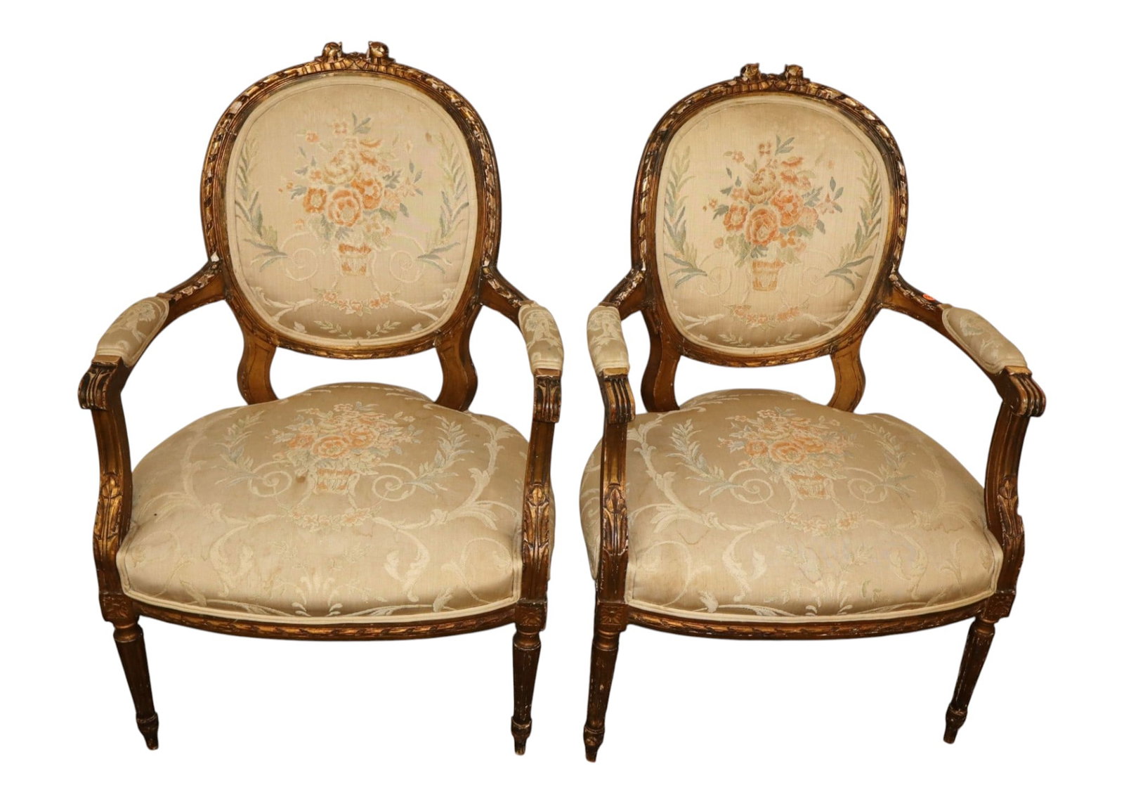 Pair of antique French medallion back arm chairs: Pair of antique French medallion back arm chairs with original petit point upholstery in carved gold gilt frame, structurally sound with age. 36"h x 24"w x 21"d seat height 16.5"