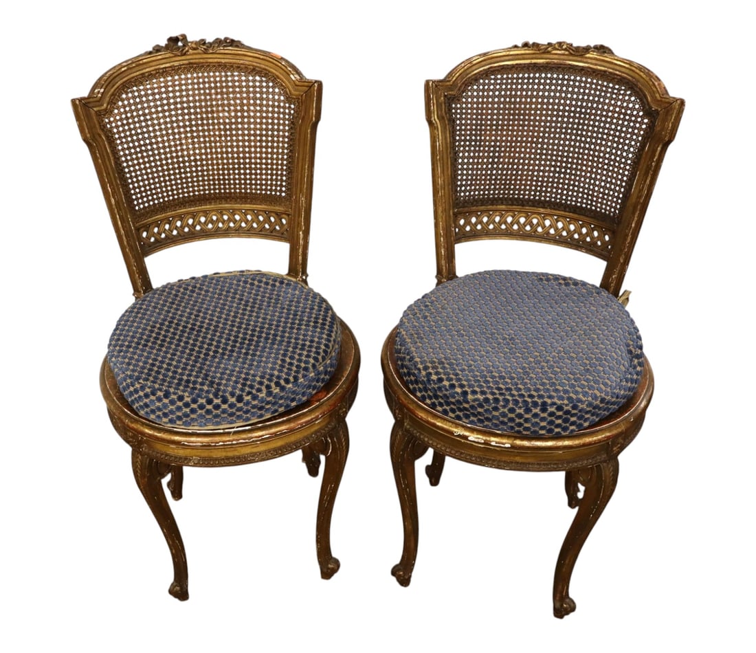 PR antique FR caned music chairs original finish: Pair of antique French caned music chairs original finish gold gilt wood frame, one seat needs recaning, missing some carving, do have patina and age. 35"h x 16" diameter with cushions 20" seat height