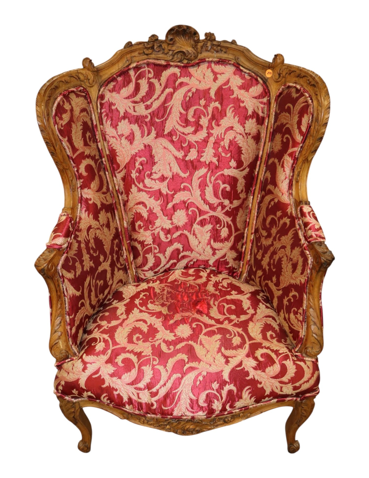 French semi antique carved uph wing back chair: French semi antique carved upholstered wing back chair, upholstery has wear, structurally sound. 40"h x 28"w x 28"d seat height 15"