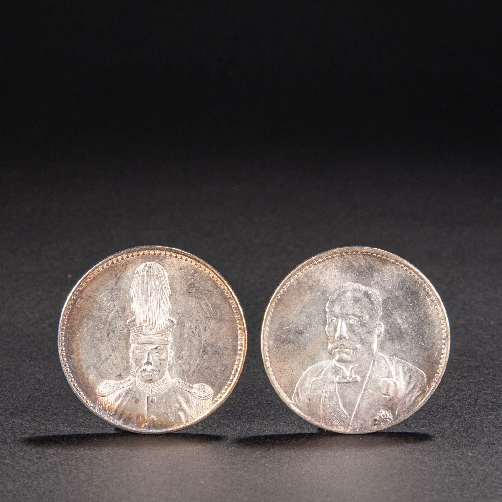 A PAIR OF CHINESE SILVER COINS (1 of 13)