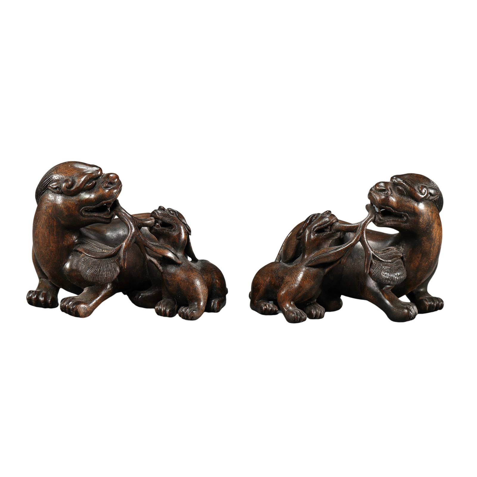 A pair of Chinese Qing Dynasty woodcarved auspicious animal paperweights (1 of 7)