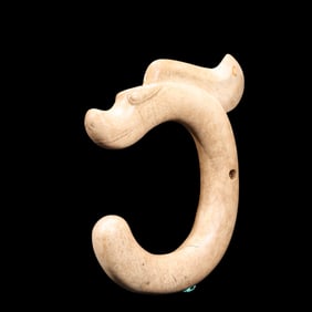 Chicken bone white jade C dragon from Hongshan culture of China during the Hongshan period