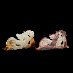 A pair of Chinese Han Dynasty white jade red skin dragon-shaped bi