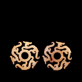 A pair of Chinese Han Dynasty jade dragon-shaped bi