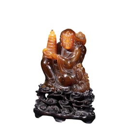 Chinese Qing Dynasty amber arhat sitting statue