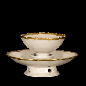 A set of Chinese northern Song Dynasty Ding ware white porcelain covered mouth flower mouth cup