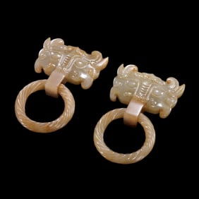 A PAIR OF CHINESE JADE SHOP HEADS, HAN DYNASTY