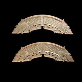 A pair of Chinese Han Dynasty jade pendants with dragon patterns