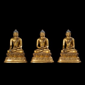 A GROUP OF CHINESE MING DYNASTY GILT BRONZE SAKYAMUNI BUDDHA SITTING STATUE