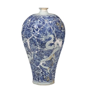 A restored piece of a Chinese Yuan Dynasty blue and white dragon-patterned plum vase