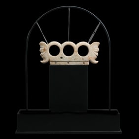 Chicken bone and white jade double-headed three-hole vessel from the Hongshan culture of the