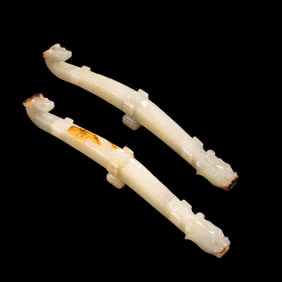 A pair of Chinese Han Dynasty white jade dragon belt hooks