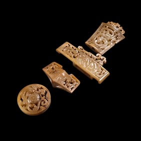 A set of Chinese Han Dynasty jade sword ornaments with dragon patterns