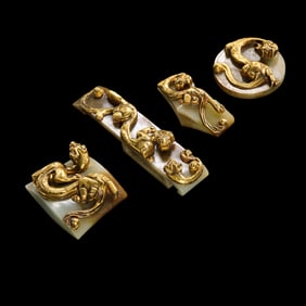A set of Chinese Han Dynasty gilded jade sword ornaments with dragon patterns