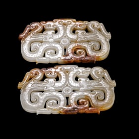 A set of Chinese Han Dynasty jade double dragon pendants