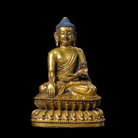 A Chinese gilt bronze statue of a seated Buddha from the Yongle period of the Ming Dynasty