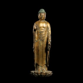 A Chinese Ming Dynasty Gilded Bronze Statue of Standing Sakyamuni Buddha