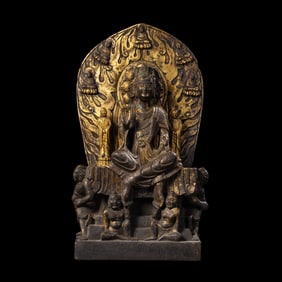 A Chinese gilt bronze statue of a seated Buddha from the Northern Qi Dynasty