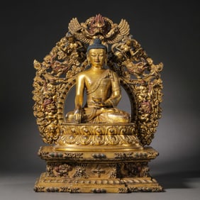 A Chinese gilt bronze statue of a seated Buddha from the Qianlong period of the Qing Dynasty