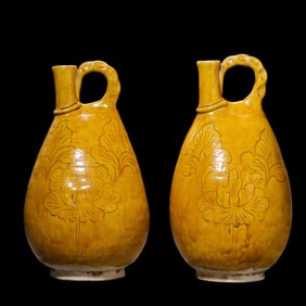 A pair of yellow-glazed chicken crown jars from the Liao Dynasty, China