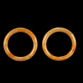 A pair of Chinese Qing Dynasty Hetian jade bracelets