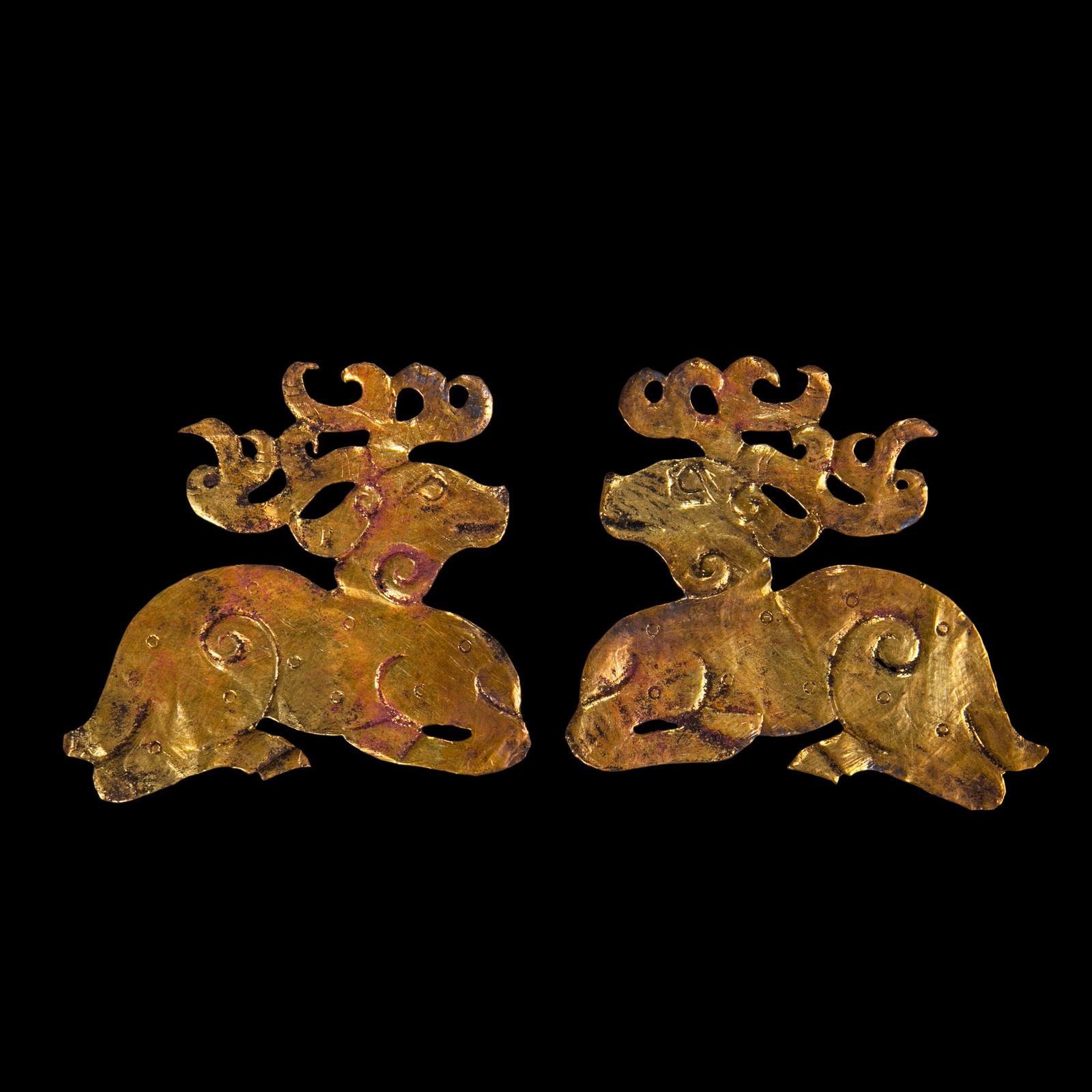 A pair of Chinese Han Dynasty pure gold deer-patterned tablets: L. 9 cm. W. 8 cm. Weight 8.1 gram.