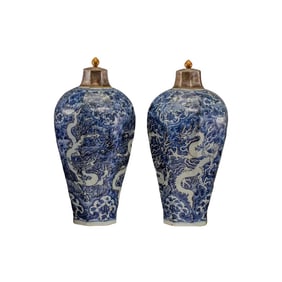 A pair of Chinese Yuan Dynasty blue and white dragon-patterned covered vases