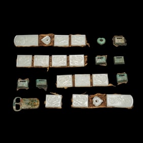 A set of silver-inlaid white jade belt plates from the Liao Dynasty, China