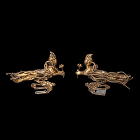 A pair of silver-gilt flying figures from the Liao Dynasty, China