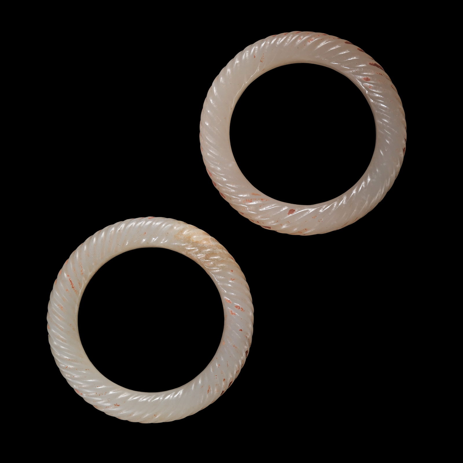 A pair of white jade rings from the Warring States Period of China: Diam. 5.1 cm. Weight 39 gram.