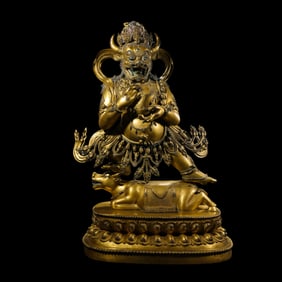 A Chinese Ming Dynasty gilt-bronze statue of Yama.