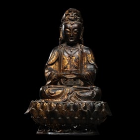 A Chinese Ming Dynasty gilt bronze statue of Seated Guanyin