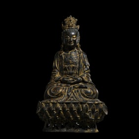 A Chinese Ming Dynasty gilt bronze statue of a seated Buddha