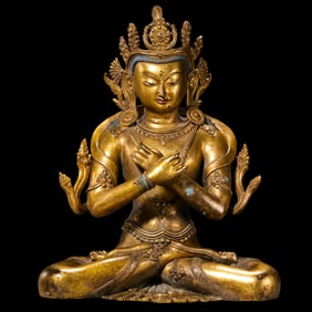 A Chinese Ming Dynasty gilt bronze statue of a seated Buddha
