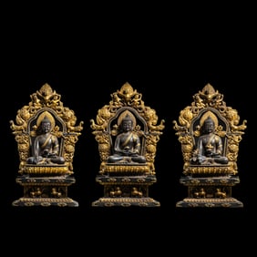 A group of Chinese Ming Dynasty gilt bronze statues of the Three Buddhas