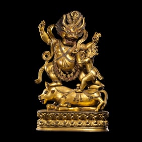 A Chinese Ming Dynasty gilt-bronze statue of Yama.