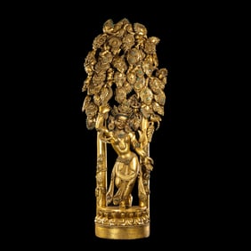 A Chinese Ming Dynasty gilt-bronze standing Buddha statue inlaid with gemstones