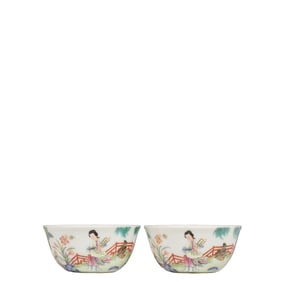 A pair of Chinese Qing Dynasty famille rose cups with story-themed figures