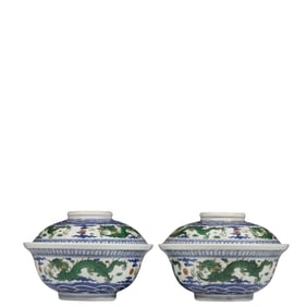 A pair of blue and white dragon-patterned covered bowls from the Jiaqing period of the Qing Dynasty