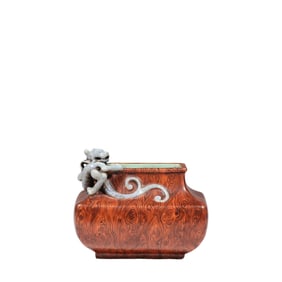 A Chinese wood-grained dragon jar from the Qianlong period of the Qing Dynasty