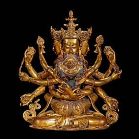 A Chinese Ming Dynasty gilt bronze statue of a seated Buddha